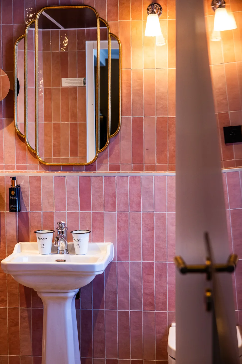 Pink Deluxe bathroom - sink, Bohem cups, gilded mirror, artisanal pink tiles